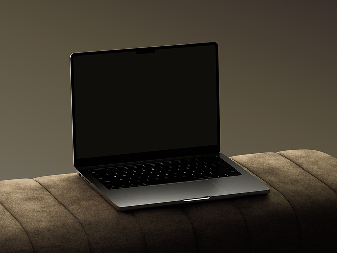 Laptop on dark couch representing digital products